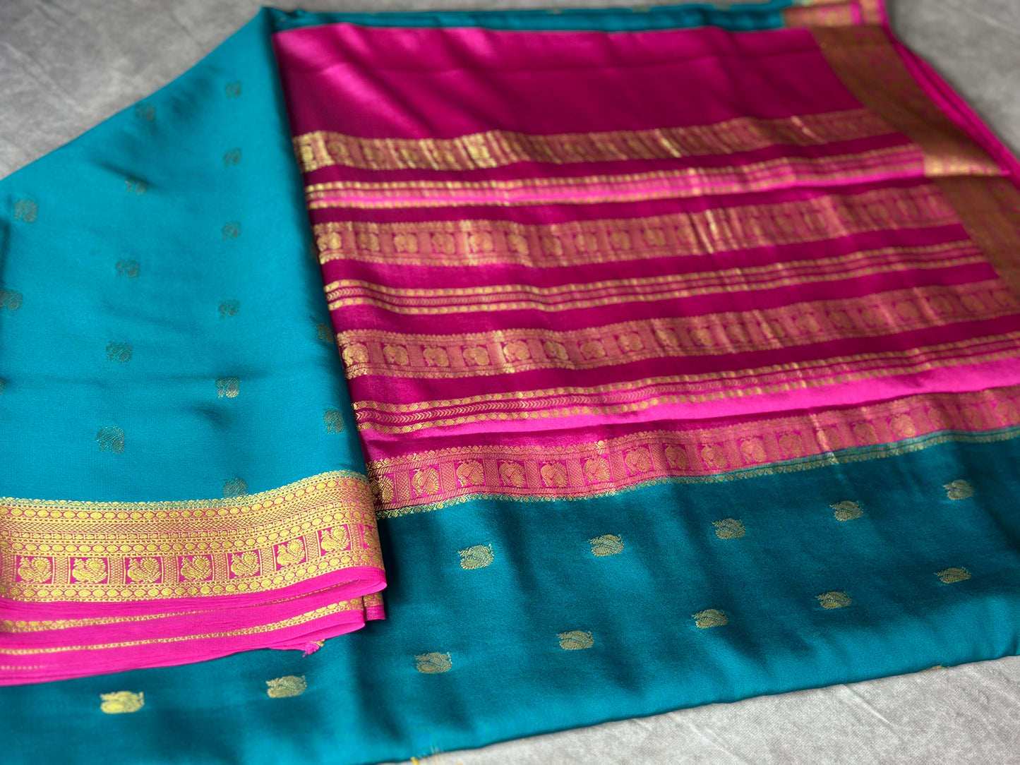 Peacock green- magenta butta pure crepe silk saree