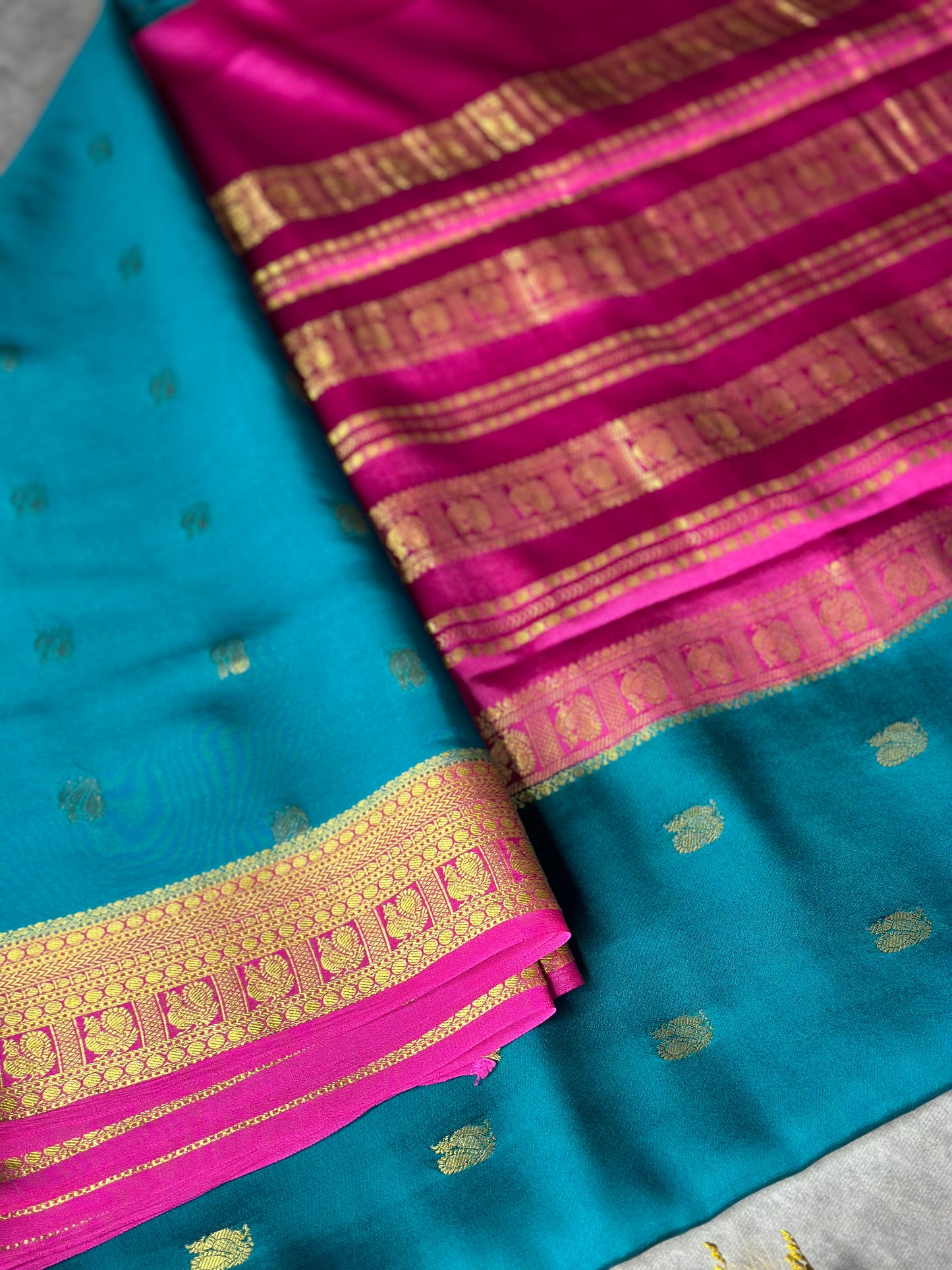 Peacock green- magenta butta pure crepe silk saree