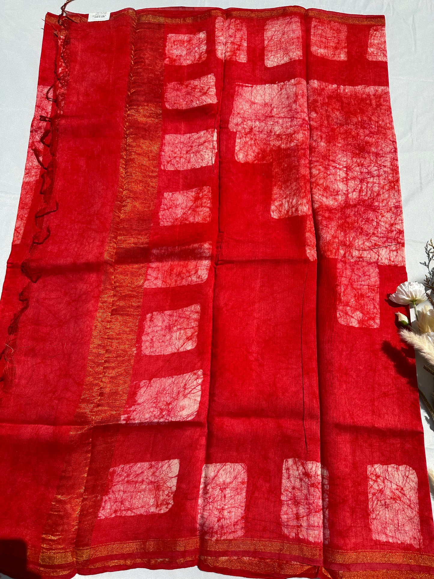 Red Cotton batik print zari less saree