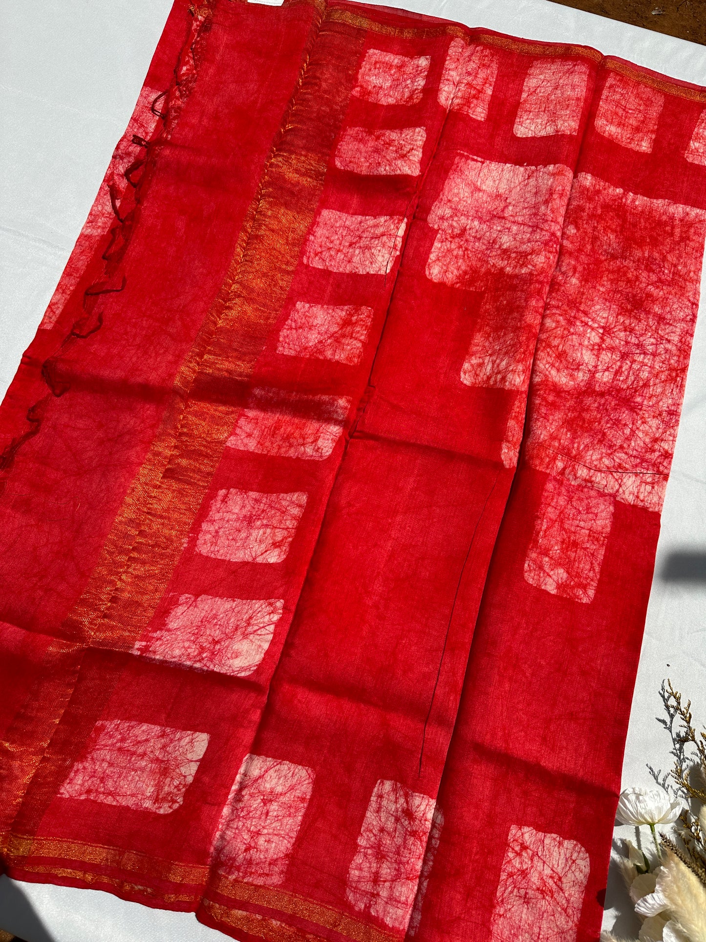 Red Cotton batik print zari less saree