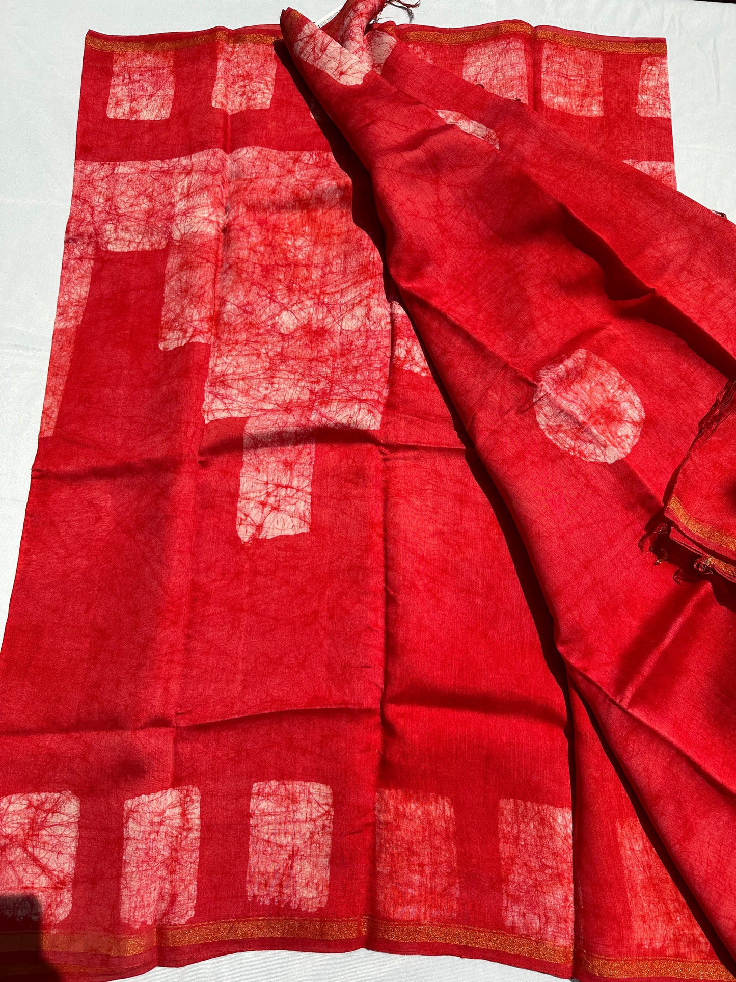 Red Cotton batik print zari less saree