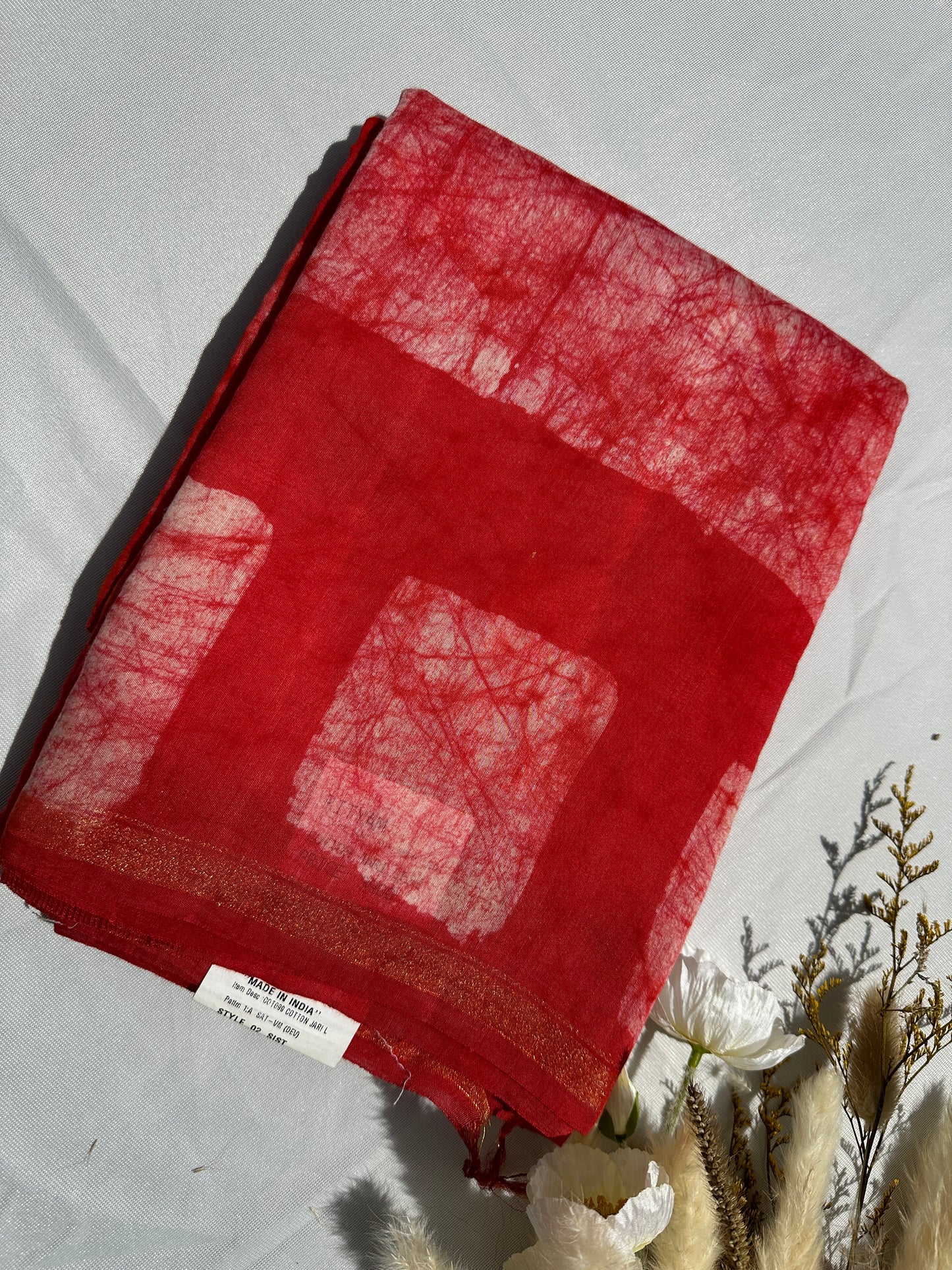 Red Cotton batik print zari less saree