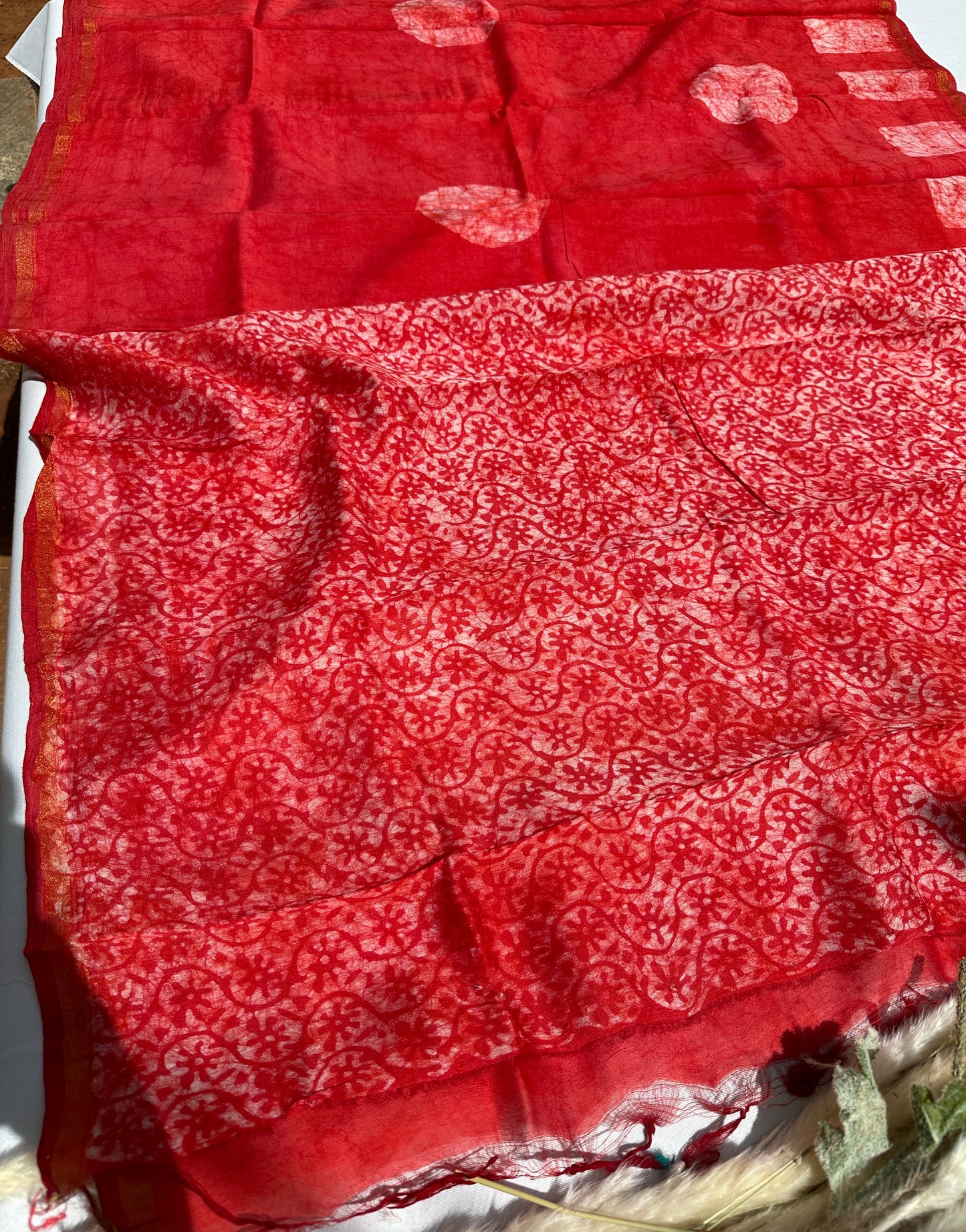 Red Cotton batik print zari less saree