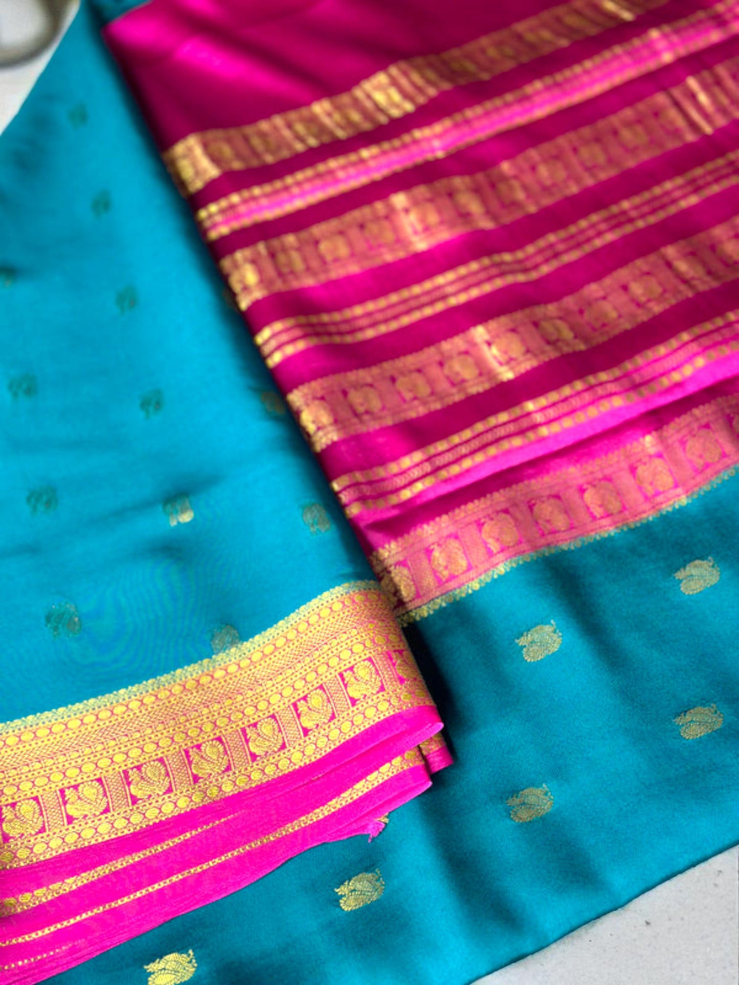 Peacock green- magenta butta pure crepe swan silk saree